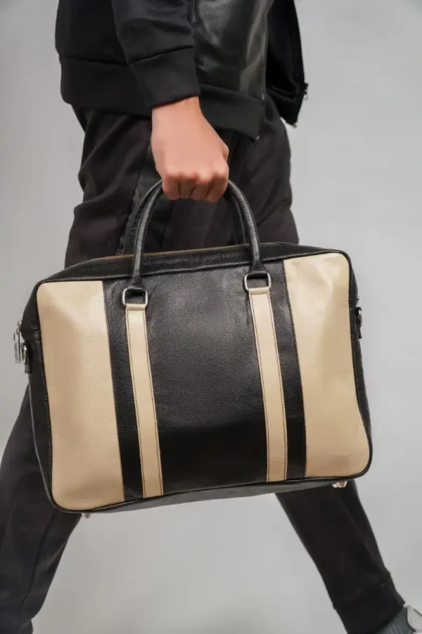 Australian-Man-Holding-Invictus-Laptop-Bag-Navy-Closeup-View-Cahlah