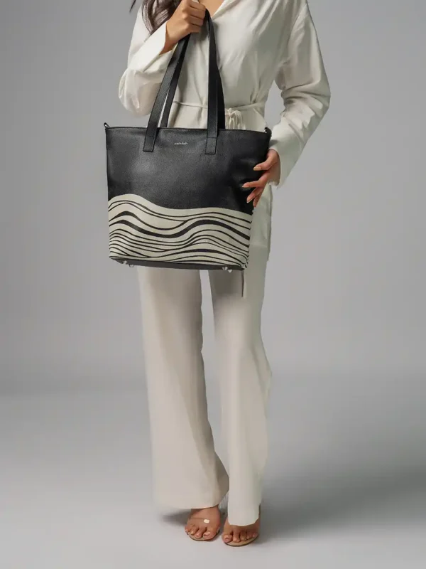 Australian-Model-Carrying-Bondi-Waves-Tote-Bag-Black-Leather-Image