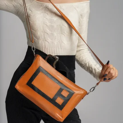Elegant-Woman-Carrying-Bloc-Crossbody-Bag-Brown-Closeup-View