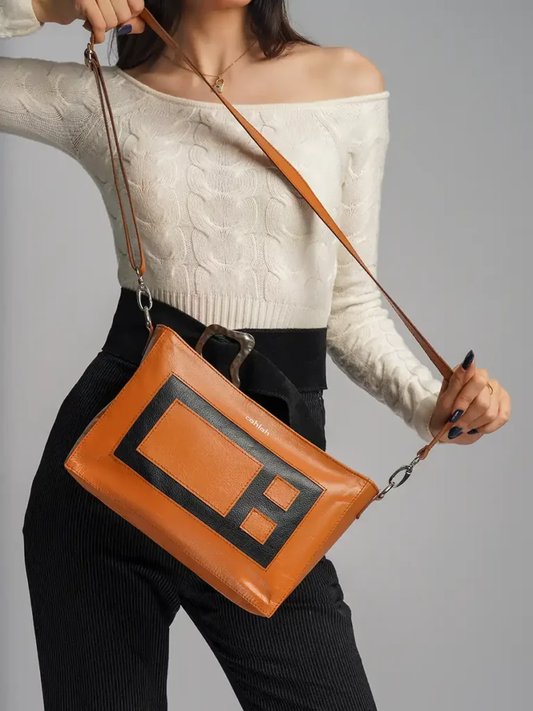 Elegant-Woman-Carrying-Bloc-Crossbody-Bag-Brown-Closeup-View