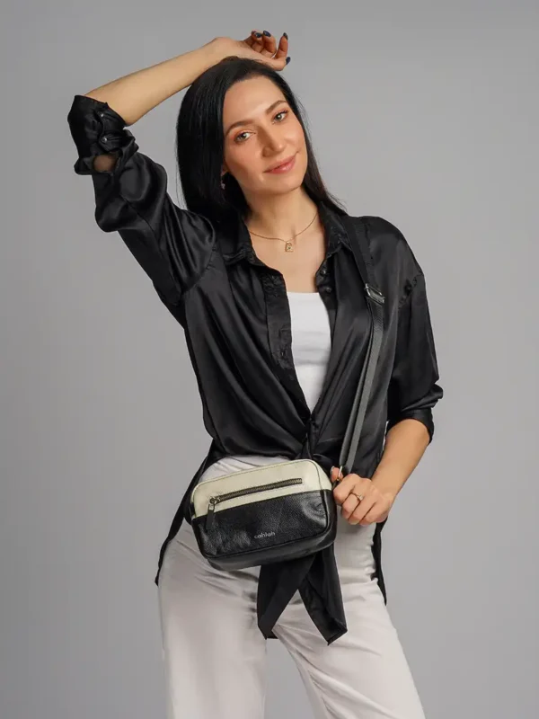 Girl-Carrying-The-Explorer’s-Route-Sling-Bag-Black-Side-View