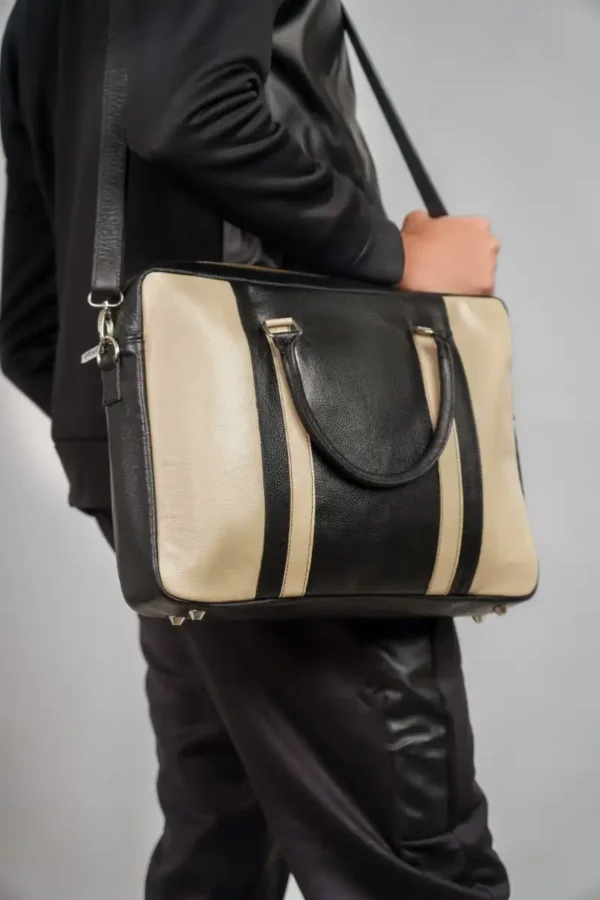 Stylist-Holding-Invictus-Laptop-Bag-Navy-Closeup-View-Cahlah