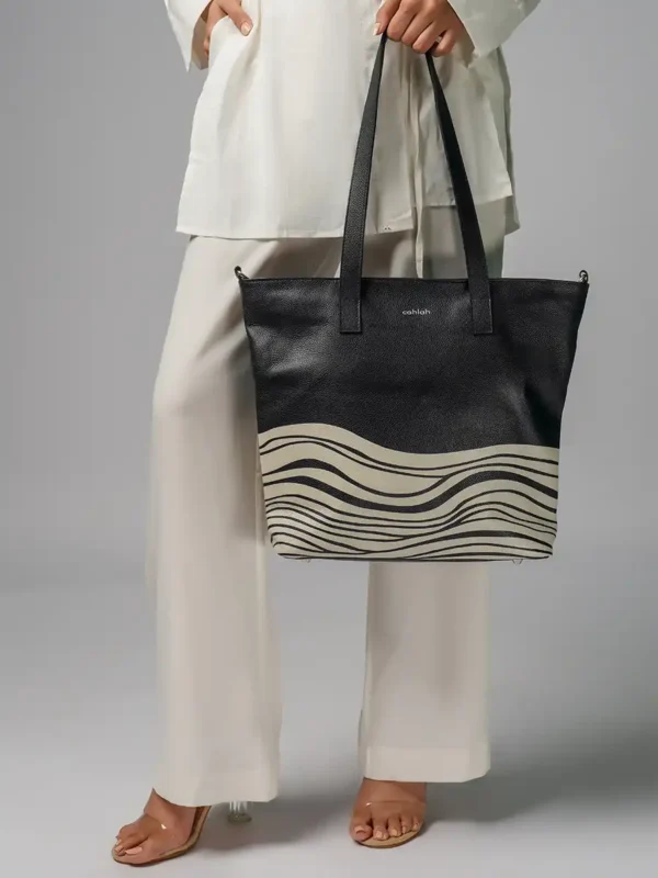 Woman-Carrying-Bondi-Waves-Tote-Bag-Black-Leather-Closeup-Image