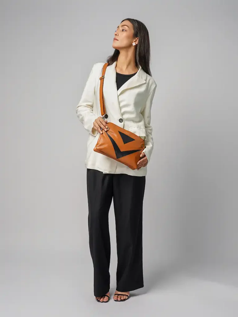 Australian-Woman-Holding-Metro-Chic-Crossbody-Bag-Brown