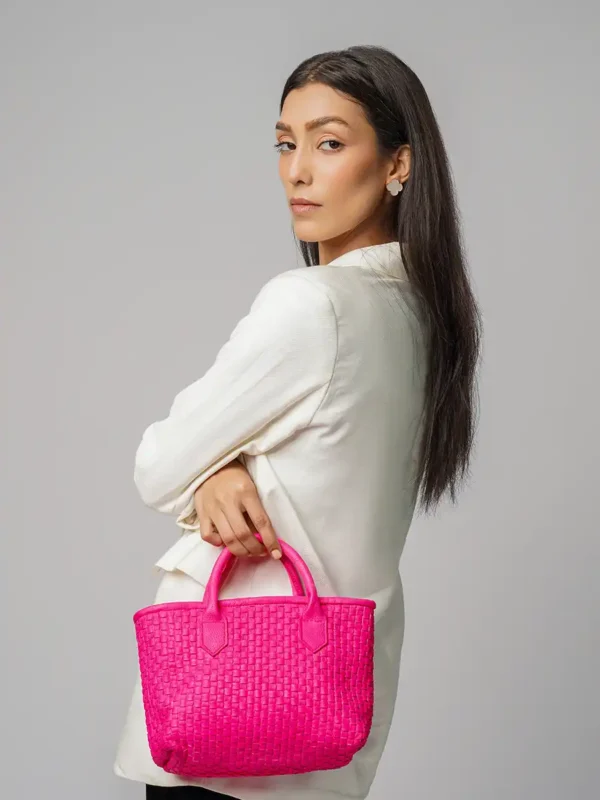 Fashion-Model-holding-Serene-Woven-Pink-Handbag