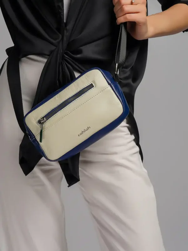 Woman-Carrying-Pathfinder-Travel-Sling-Bag-Navy