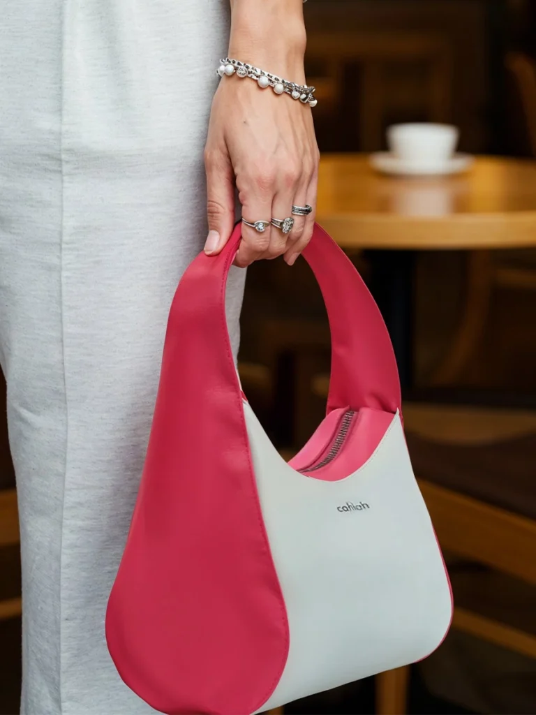 Woman-Indoor-Holding-Celeste-Hobo-Handbag-Pink-Cahlah-Australia